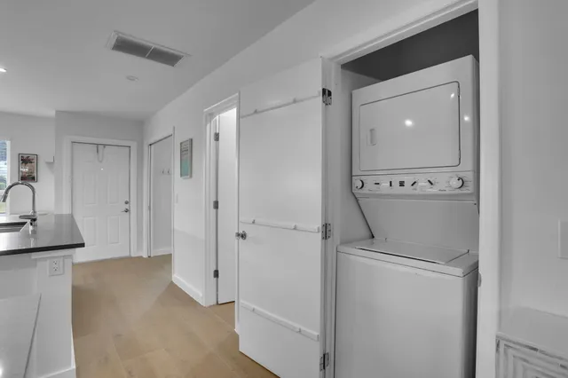 a view of a storage & utility room with a sink
