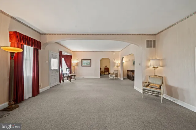 a view of livingroom with furniture and windows