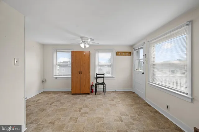 a kitchen with stainless steel appliances granite countertop a sink a stove a refrigerator with grey cabinets