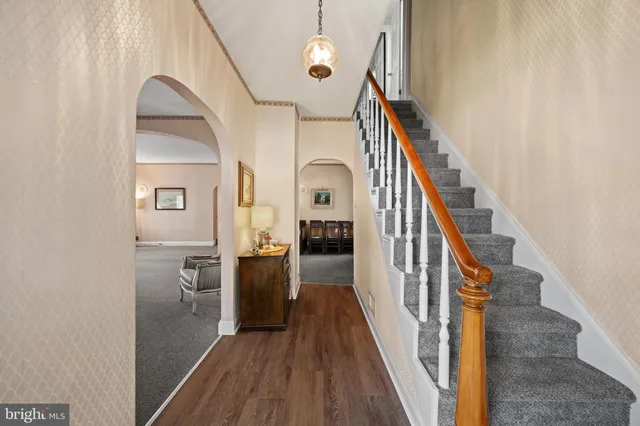 a view of a livingroom with a furniture and staircase