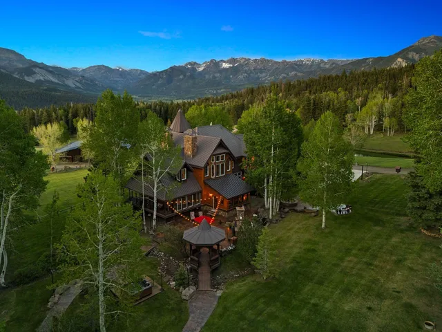 a view of backyard with swimming pool and outdoor seating