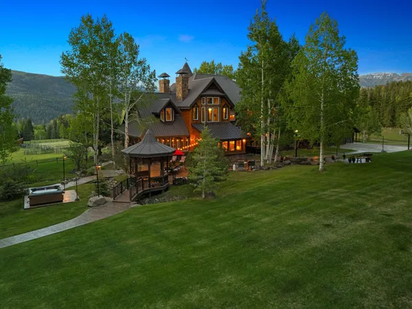 a view of a park with iron fence
