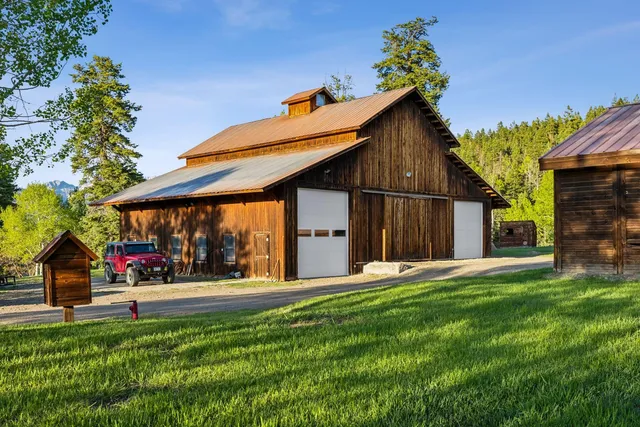 a view of a chairs and table in the balcony