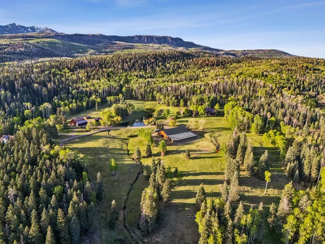 a bed room with a bed and a chair