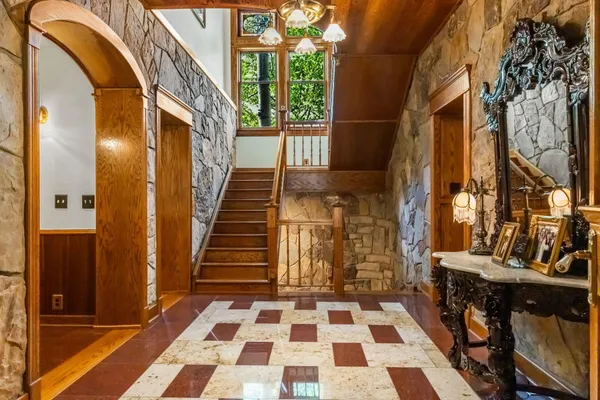 a living room with large window and a table