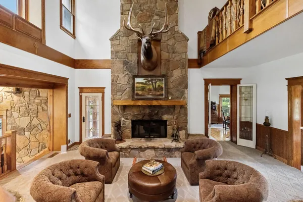 a bed room with a bed and a chair