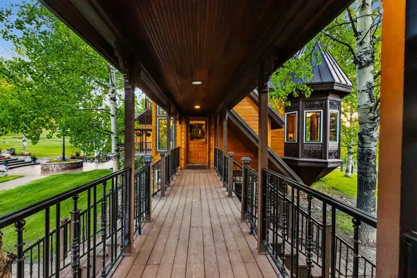 a view of a chair and tables in the patio
