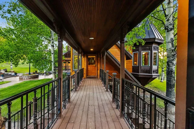 a view of a chair and tables in the patio