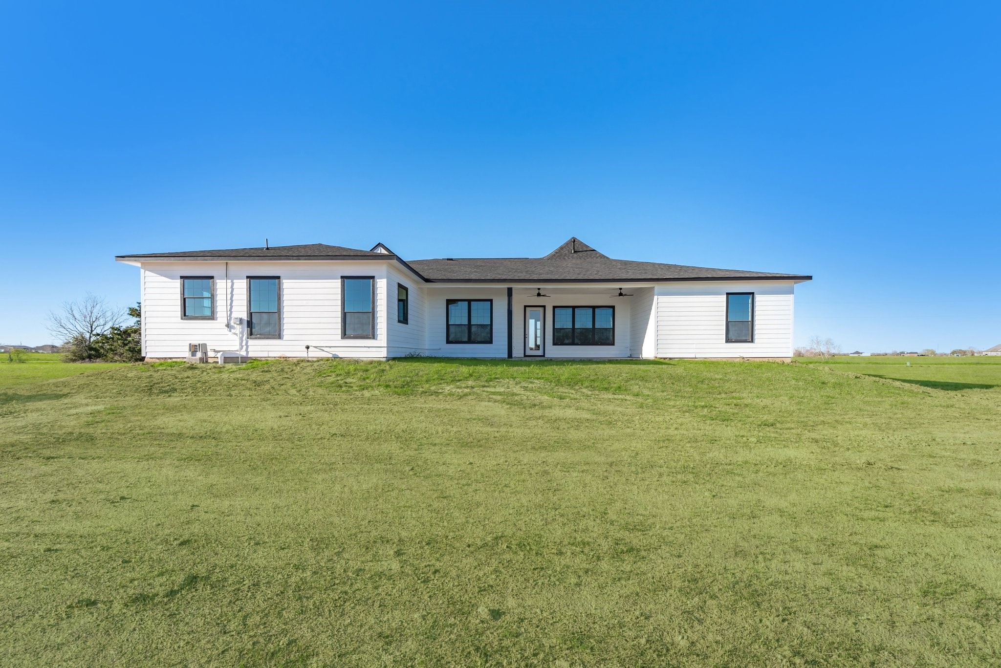 519 Chuckwagon Trail Angleton, TX 77515 - Photo 31 of 34 a front view of a house with a garden