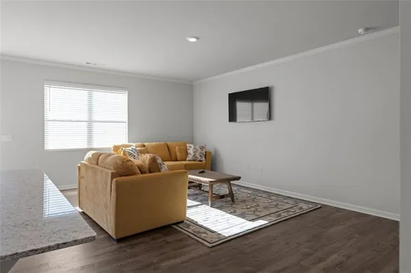 a living room with a couch and a window