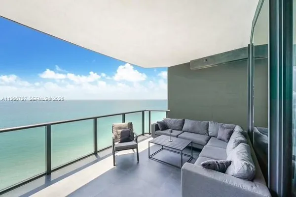 a balcony and livingroom with furniture