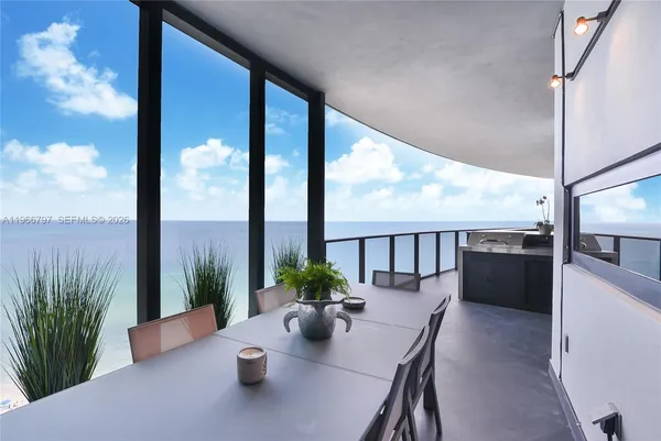 a view of balcony with wooden floor
