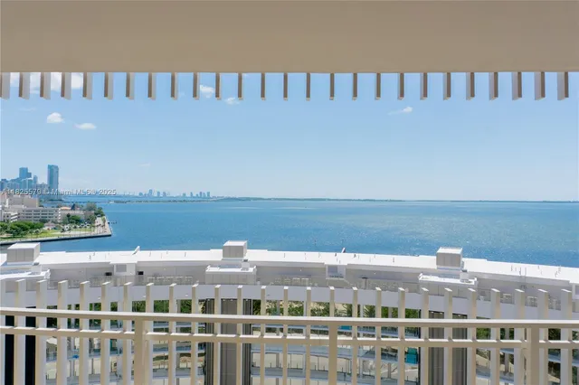 a kitchen with a sink and a large window