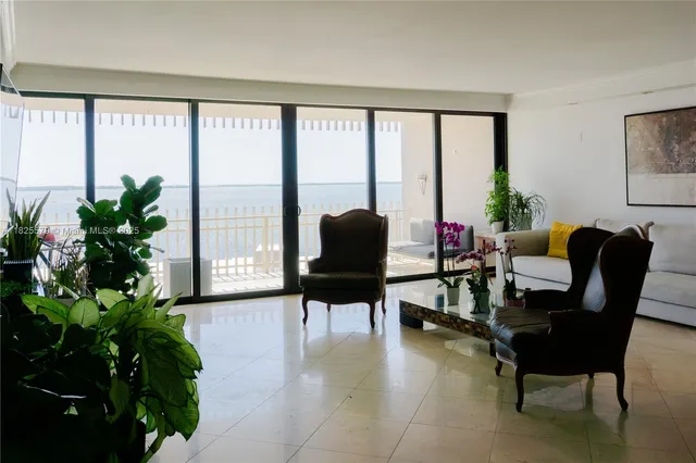 a kitchen with a sink and a stove top oven with wooden floor