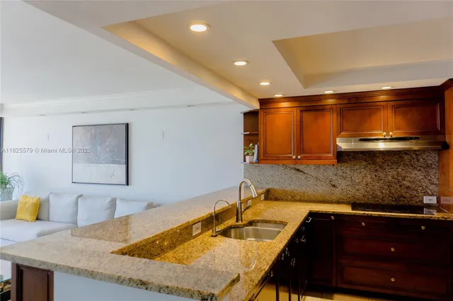 a kitchen with a sink and a refrigerator