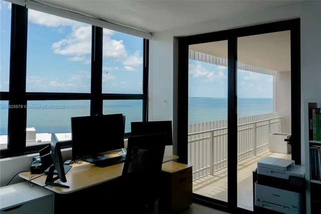 a bedroom with a bed window and a desk