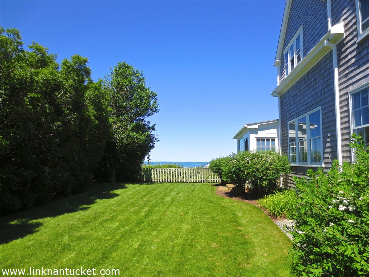 47 Cliff Road Nantucket, MA 02554 - Photo 11 of 22 a front view of a house with a yard