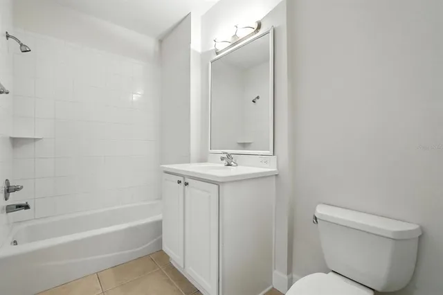 an aerial view of residential houses with outdoor space and swimming pool