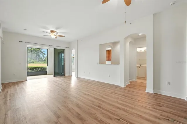 a kitchen with granite countertop a sink stove and refrigerator