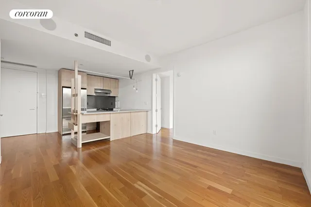 a view of kitchen with refrigerator stove microwave and cabinets