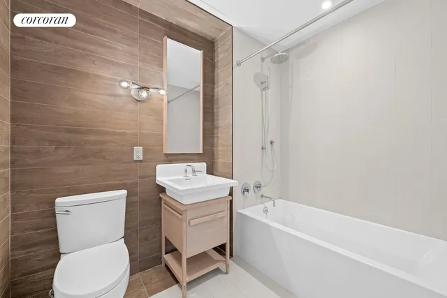 a bathroom with a toilet a sink and bathtub