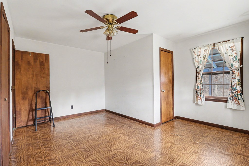 595 Wildlife Trail Morganton, GA 30560 - Photo 12 of 34 wooden floor in an empty room with a window