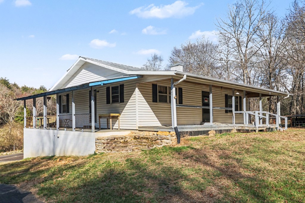 595 Wildlife Trail Morganton, GA 30560 - Photo 3 of 34 a house with trees in the background