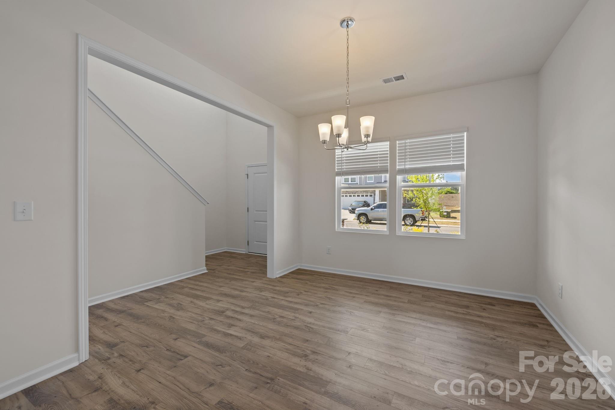 463 Brick House Road York, SC 29745 - Photo 8 of 35 an empty room with wooden floor and outdoor view