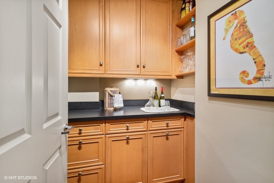 1335 South Prairie Avenue, Unit 605 Chicago, IL 60605 - Photo 17 of 20 a kitchen with stainless steel appliances granite countertop a sink and cabinets
