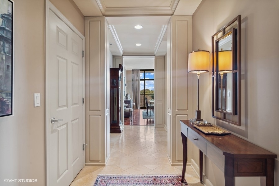 1335 South Prairie Avenue, Unit 605 Chicago, IL 60605 - Photo 2 of 20 a view of a hallway with wooden floor and glass door