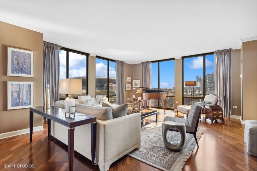 1335 South Prairie Avenue, Unit 605 Chicago, IL 60605 - Photo 3 of 20 a living room with furniture and floor to ceiling windows wooden floor