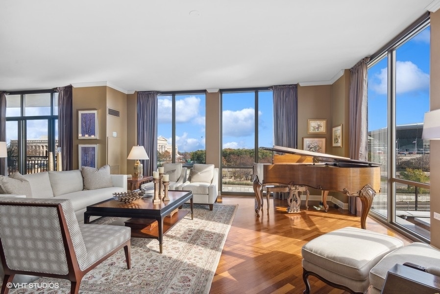 1335 South Prairie Avenue, Unit 605 Chicago, IL 60605 - Photo 4 of 20 a living room with furniture and a floor to ceiling window