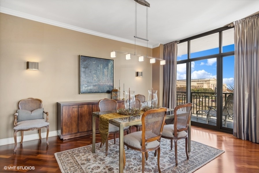 1335 South Prairie Avenue, Unit 605 Chicago, IL 60605 - Photo 7 of 20 a dining room with furniture a chandelier and wooden floor