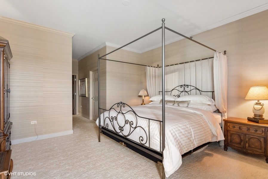 1335 South Prairie Avenue, Unit 605 Chicago, IL 60605 - Photo 9 of 20 a bedroom with a bed and a night stand