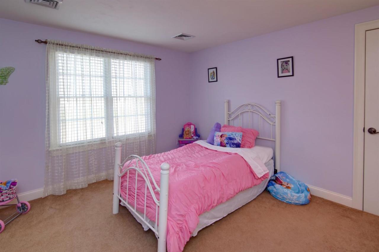 7 Webquish Lane Mashpee, MA 02649 - Photo 13 of 28 a bedroom with a bed and a window