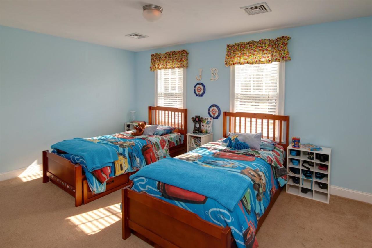 7 Webquish Lane Mashpee, MA 02649 - Photo 14 of 28 a bedroom with two beds and a window