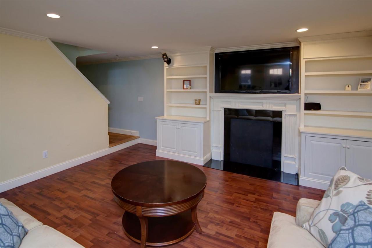 7 Webquish Lane Mashpee, MA 02649 - Photo 16 of 28 a living room with furniture and a flat screen tv