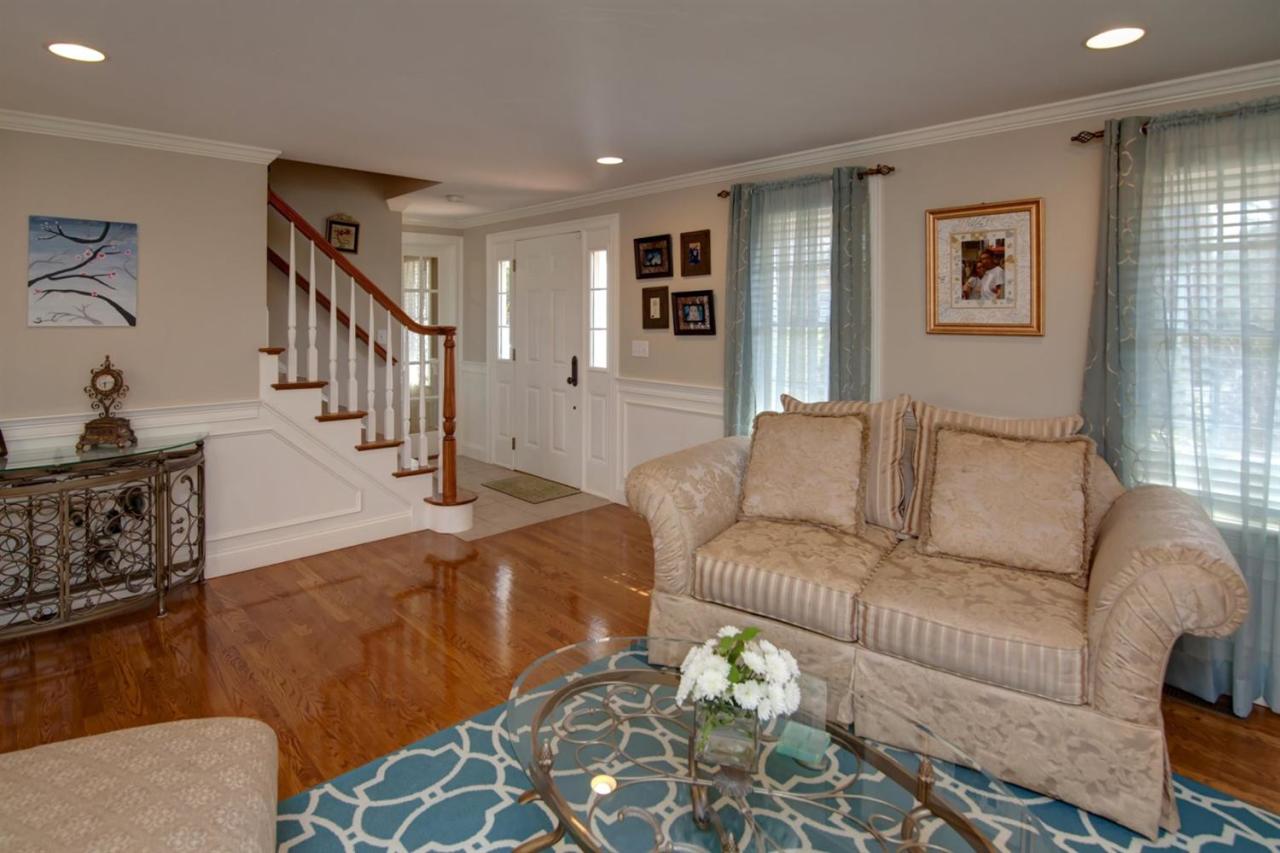 7 Webquish Lane Mashpee, MA 02649 - Photo 2 of 28 a living room with furniture and wooden floor