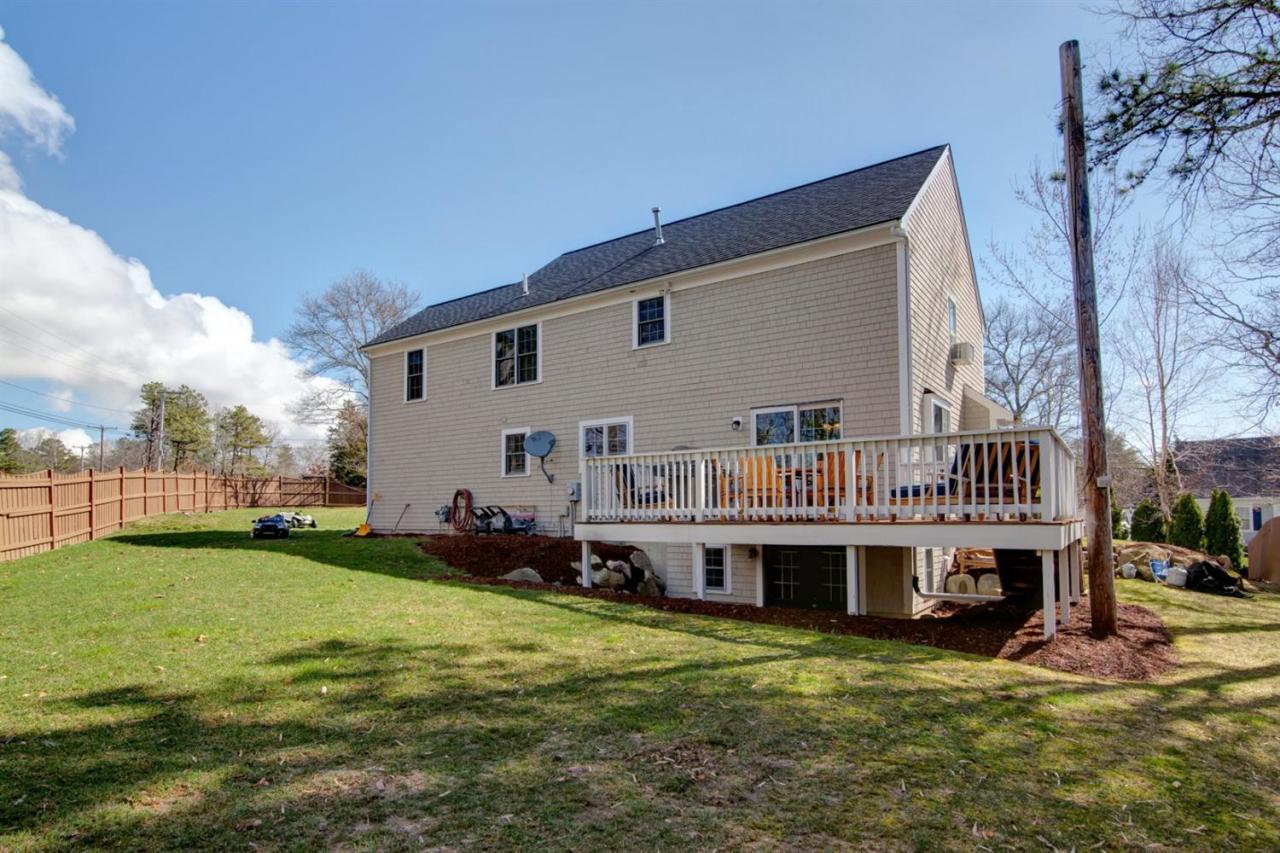 7 Webquish Lane Mashpee, MA 02649 - Photo 21 of 28 a view of a house with a roof deck