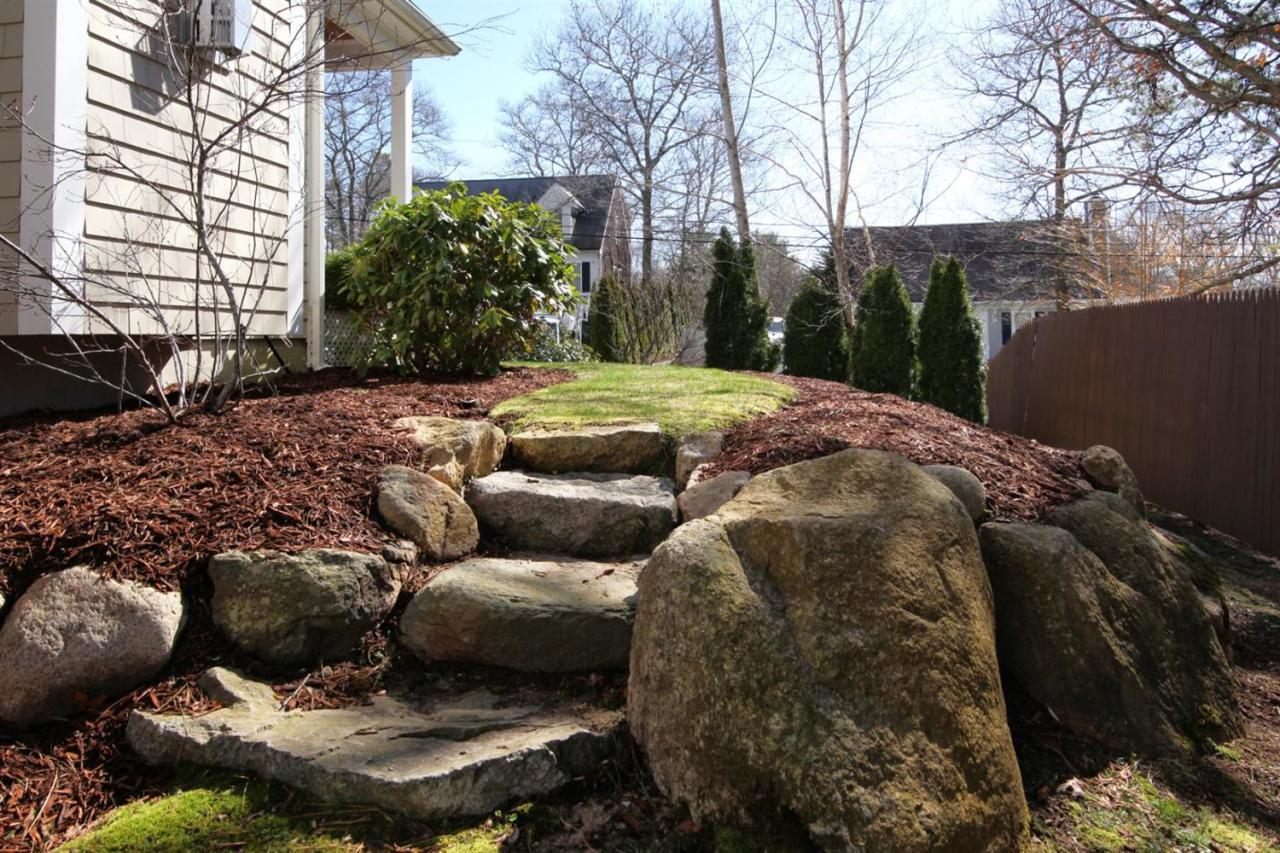7 Webquish Lane Mashpee, MA 02649 - Photo 24 of 28 a view of a backyard of the house