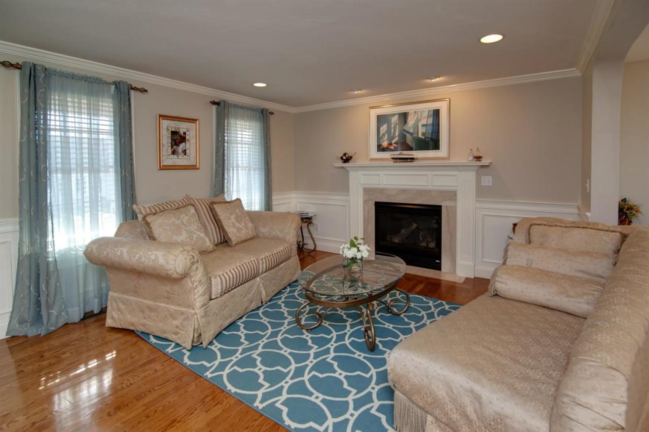 7 Webquish Lane Mashpee, MA 02649 - Photo 4 of 28 a living room with furniture and a fireplace
