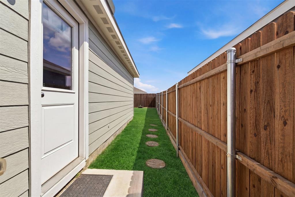 5969 Sumlin Way Princeton, TX 75407 - Photo 21 of 26 a view of a pathway of a house with wooden floor