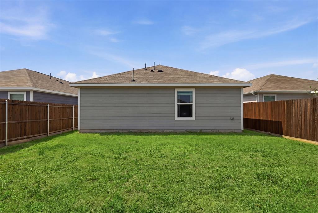 5969 Sumlin Way Princeton, TX 75407 - Photo 23 of 26 a front view of a house with a yard
