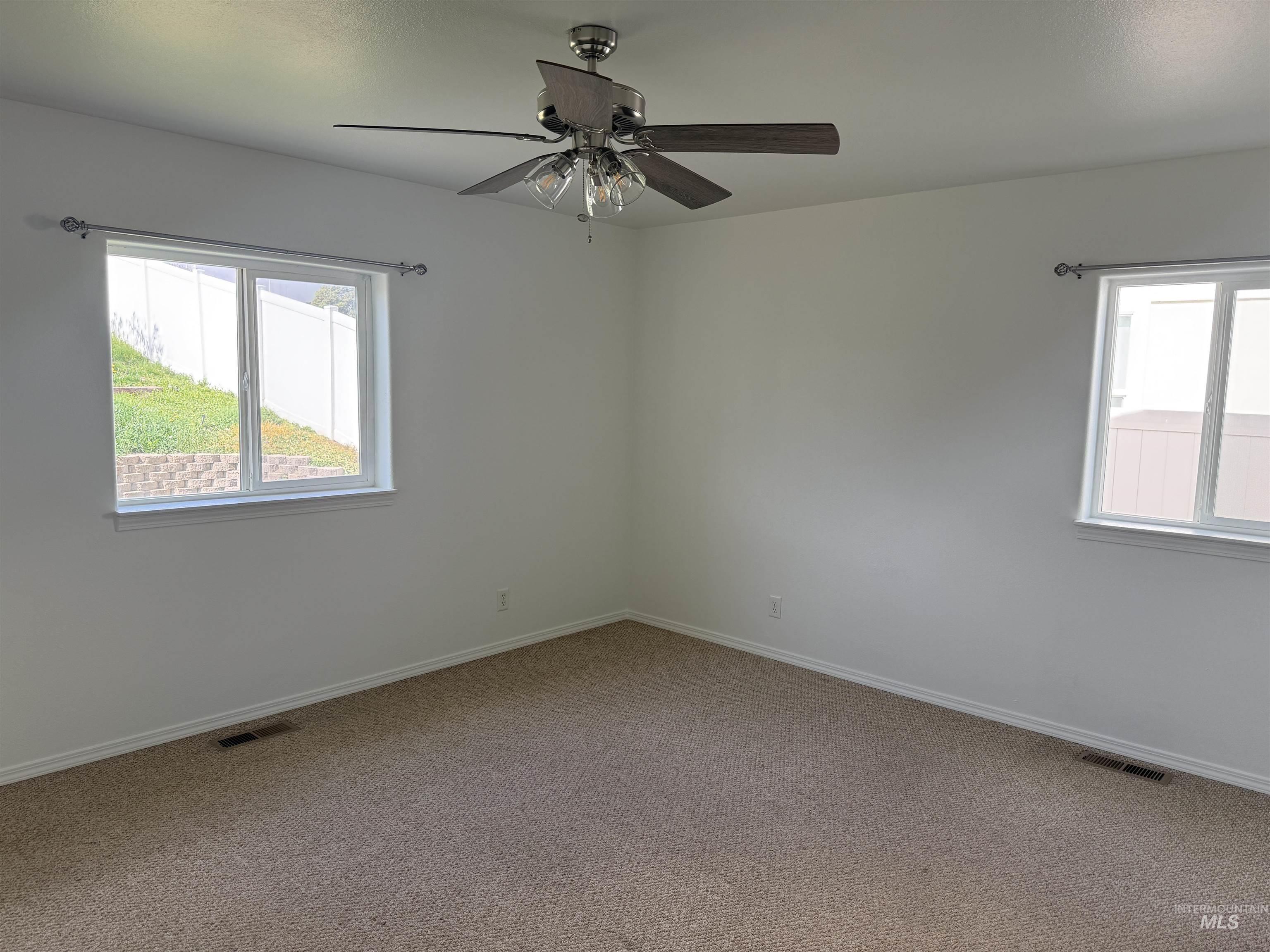 523 Morning Dove Way Marsing, ID 83639 - Photo 19 of 23 Unfurnished room with carpet flooring and ceiling fan