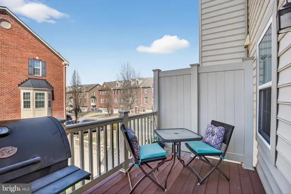 a view of a balcony with furniture