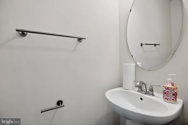a bathroom with a sink and mirror