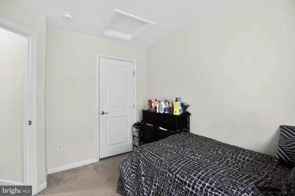 a bedroom with a bed and a closet