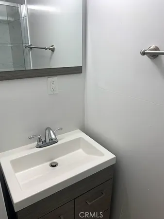 a bathroom with a sink and cabinets