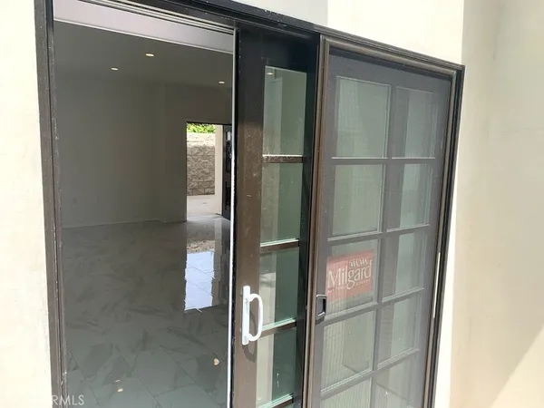 a bathroom with a glass shower door