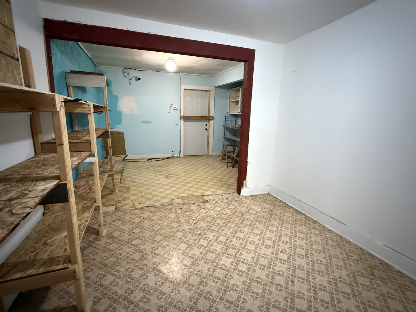123 West St Paul Street Spring Valley, IL 61362 - Photo 14 of 28 an empty room with wooden floor and a bathroom